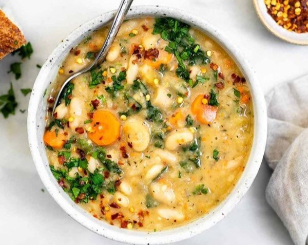 Hearty Vegetarian Tuscan White Bean Soup with Spinach and Herbs top view